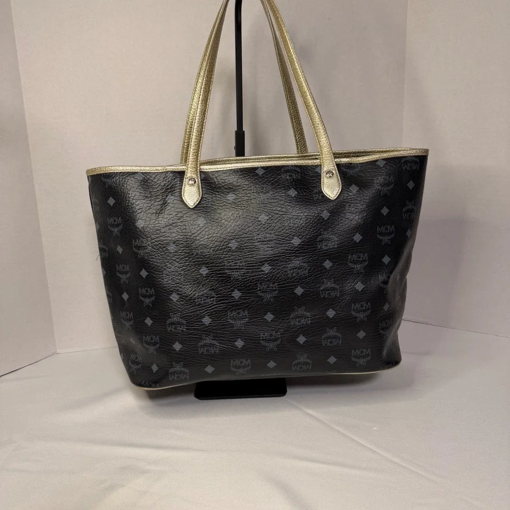 MCM Visetos Monogram Medium Tote Bag Black Gold‎ Lion Graphic Striped